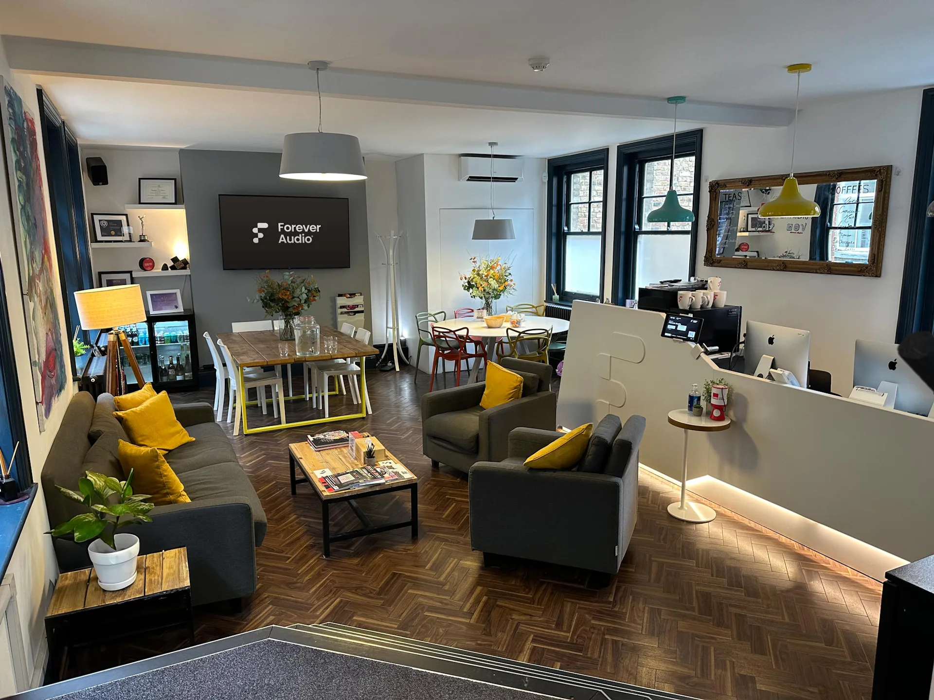 Bright reception with sofas and desk